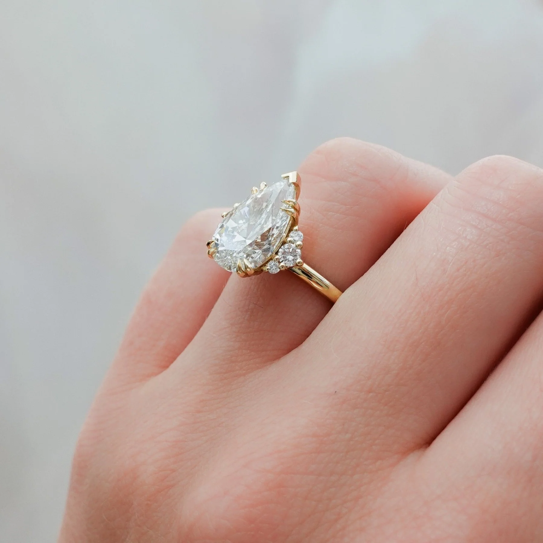 Signature Cluster Engagement Ring With Pear Cut Diamond - Image 6