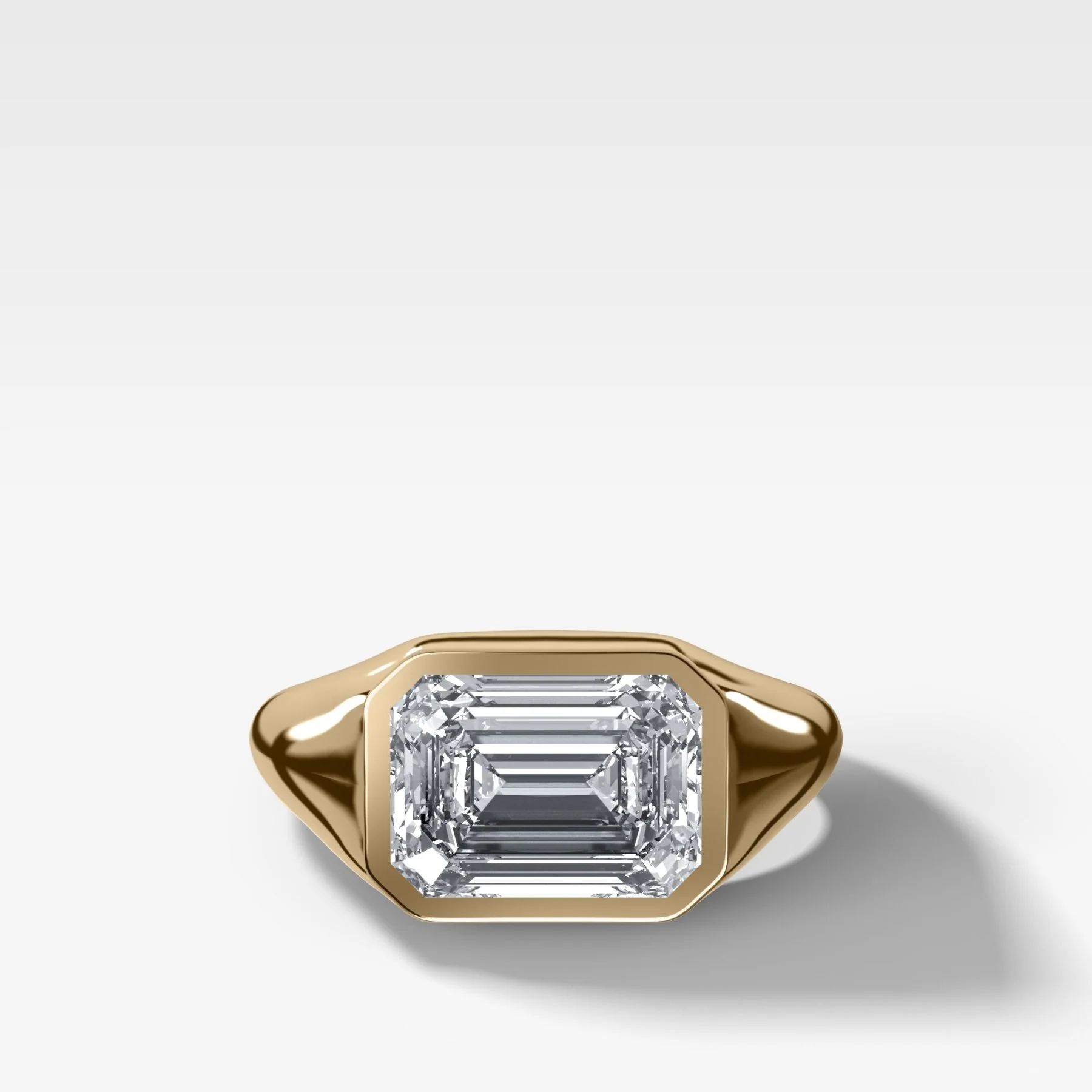 Tapered Bezel Signet Engagement Ring with East West Emerald Cut Diamond