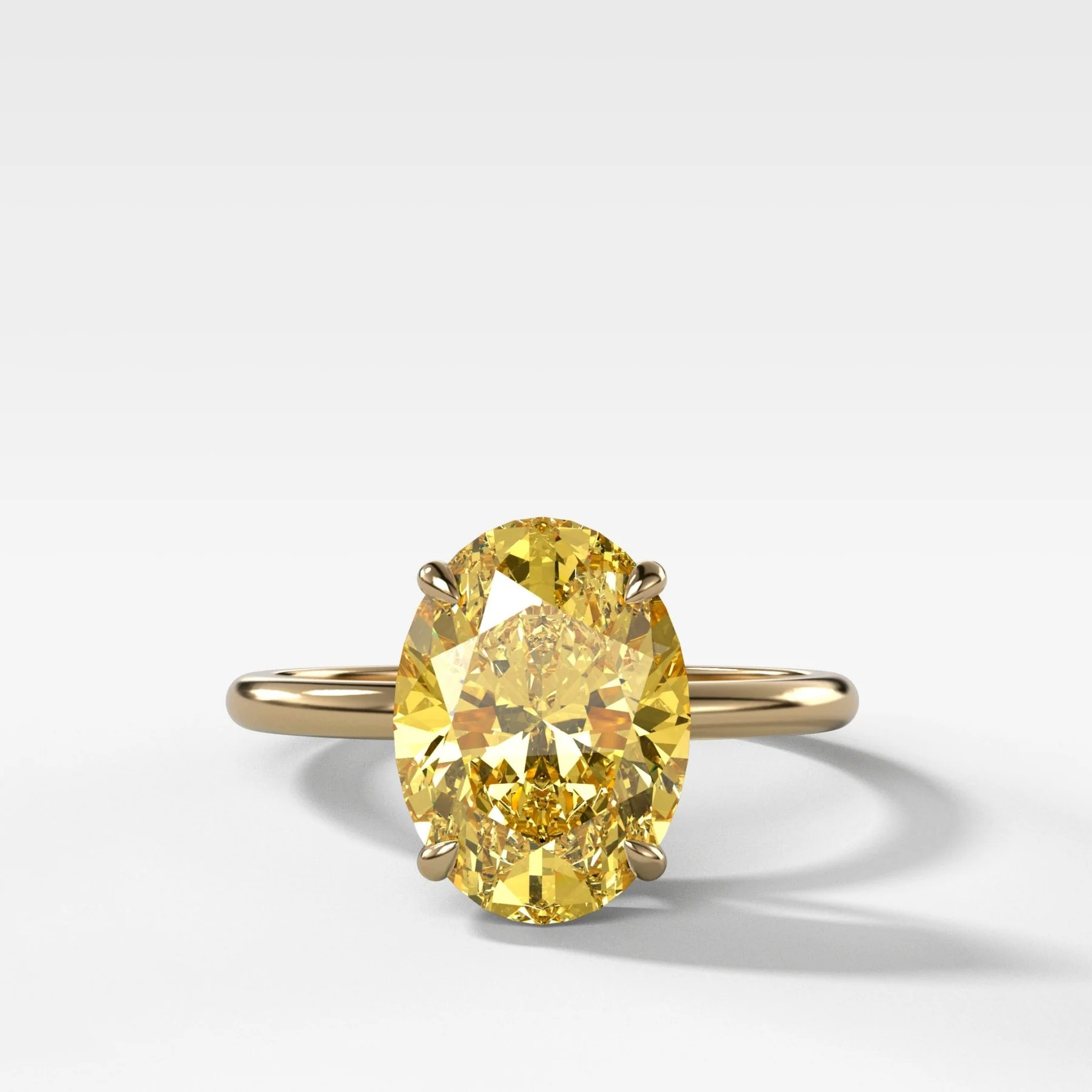 Thin + Simple Solitaire Engagement Ring With Canary Yellow Oval Cut Diamond
