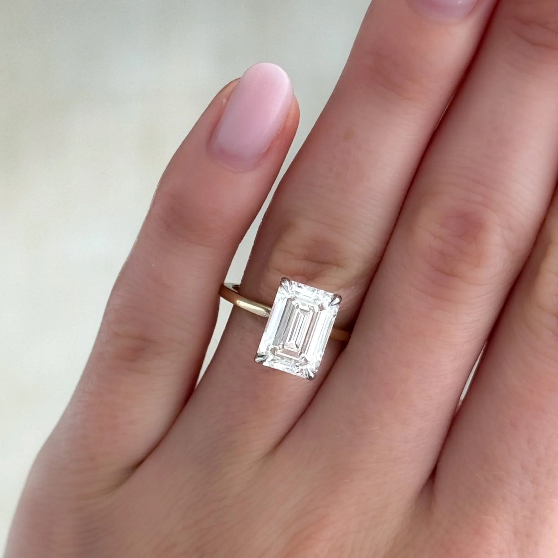 Thin + Simple Solitaire Engagement Ring With North South Emerald Cut Diamond - Image 7