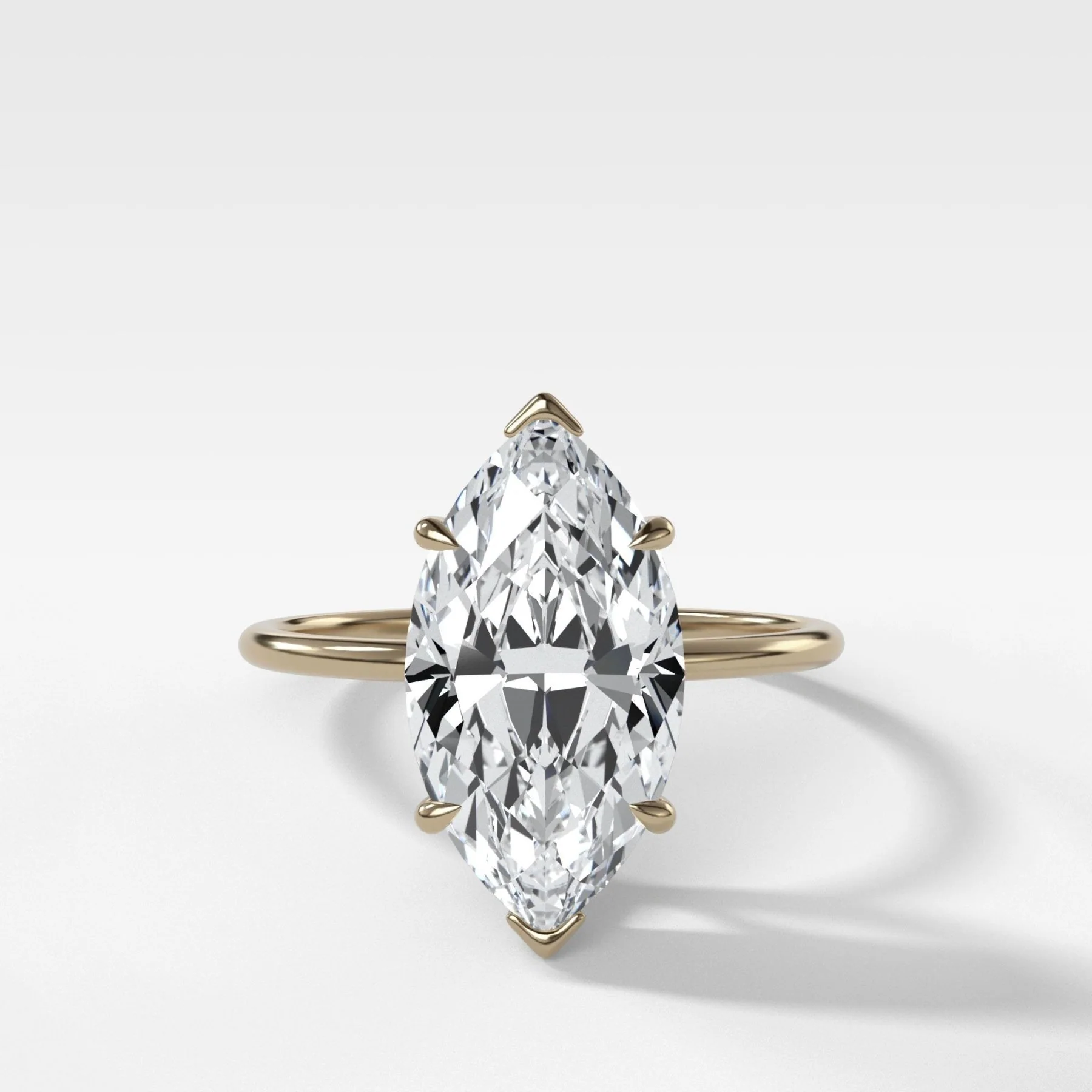 Thin + Simple Solitaire Engagement Ring With Marquise Cut Diamond