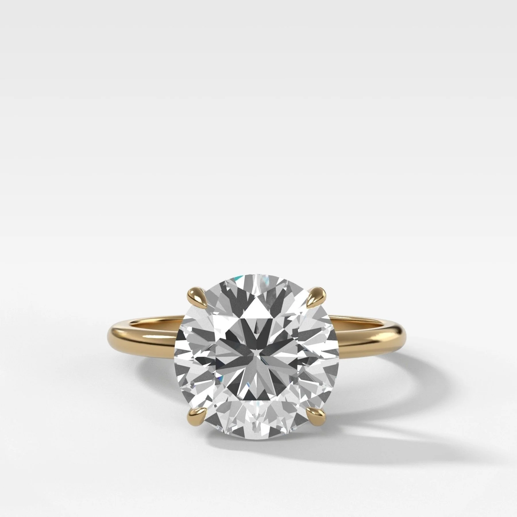 Thin + Simple Solitaire Engagement Ring With Round Brilliant Cut Diamond