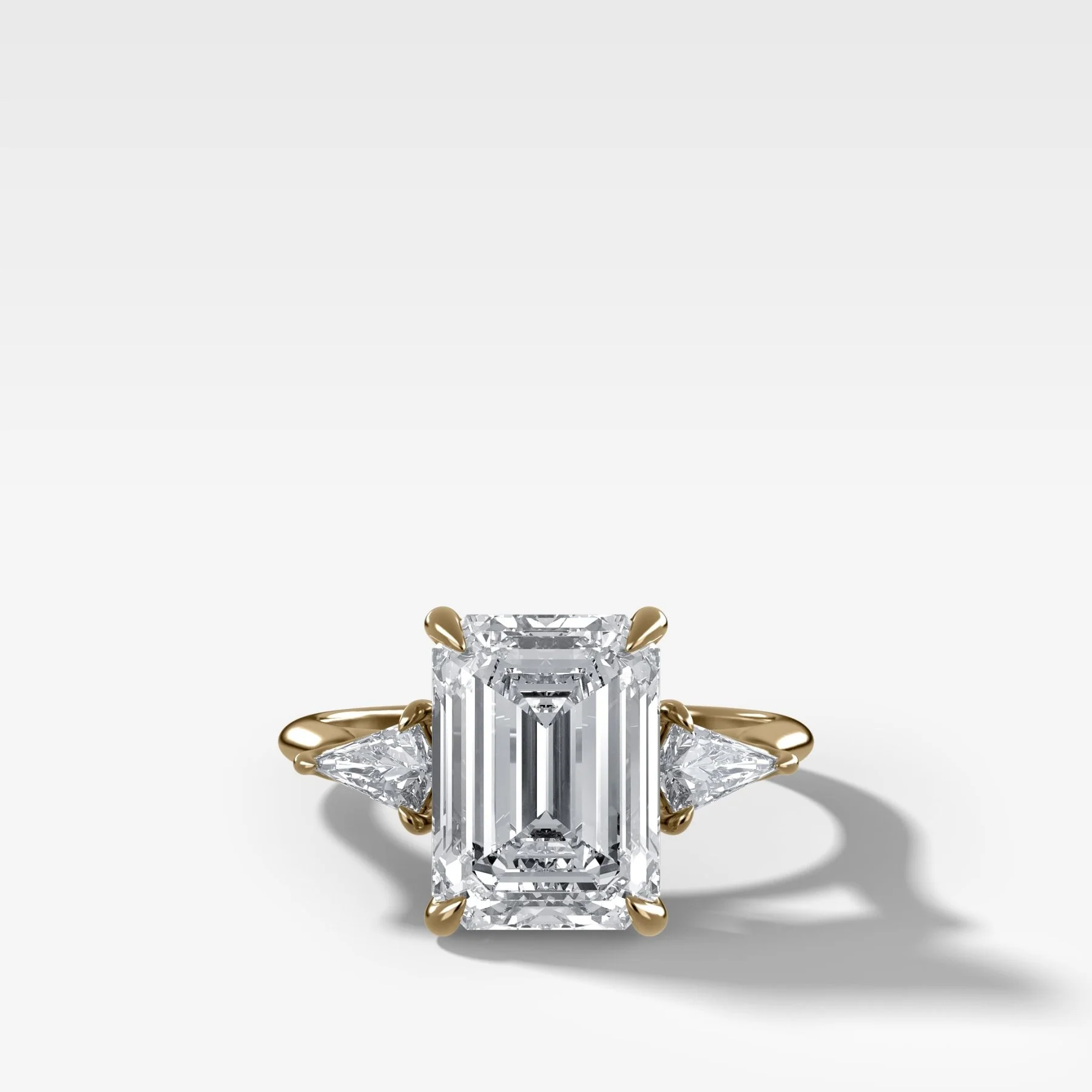 Three Stone Engagement Ring With Kite Side Stones and Emerald Cut Diamond