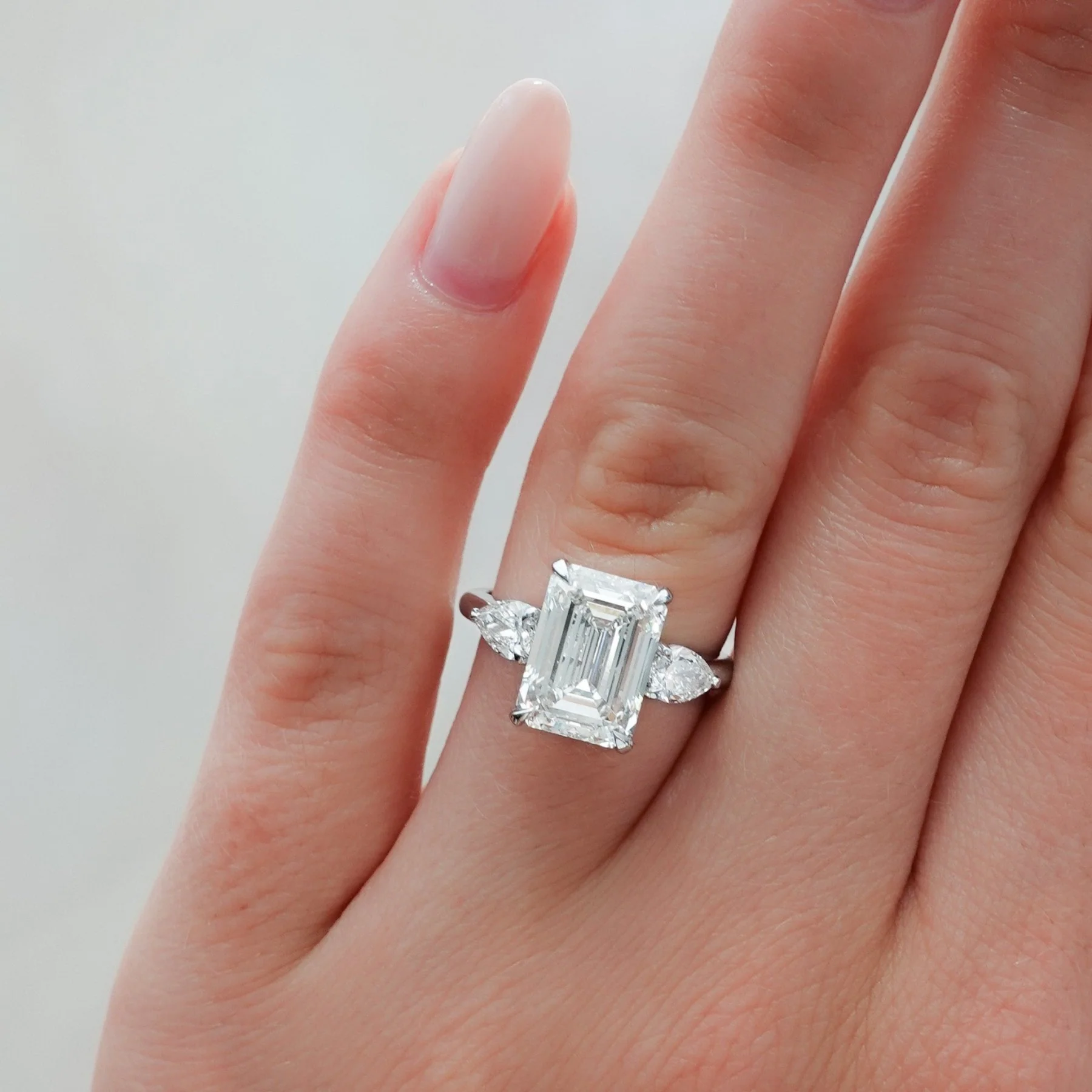 Three Stone Engagement Ring With Pear Side Stones and Emerald Cut Diamond - Image 6