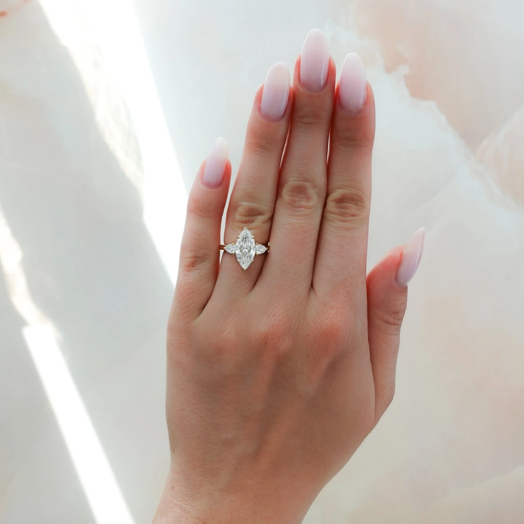Three Stone Engagement Ring With Pear Side Stones and Marquise Cut Diamond - Image 3