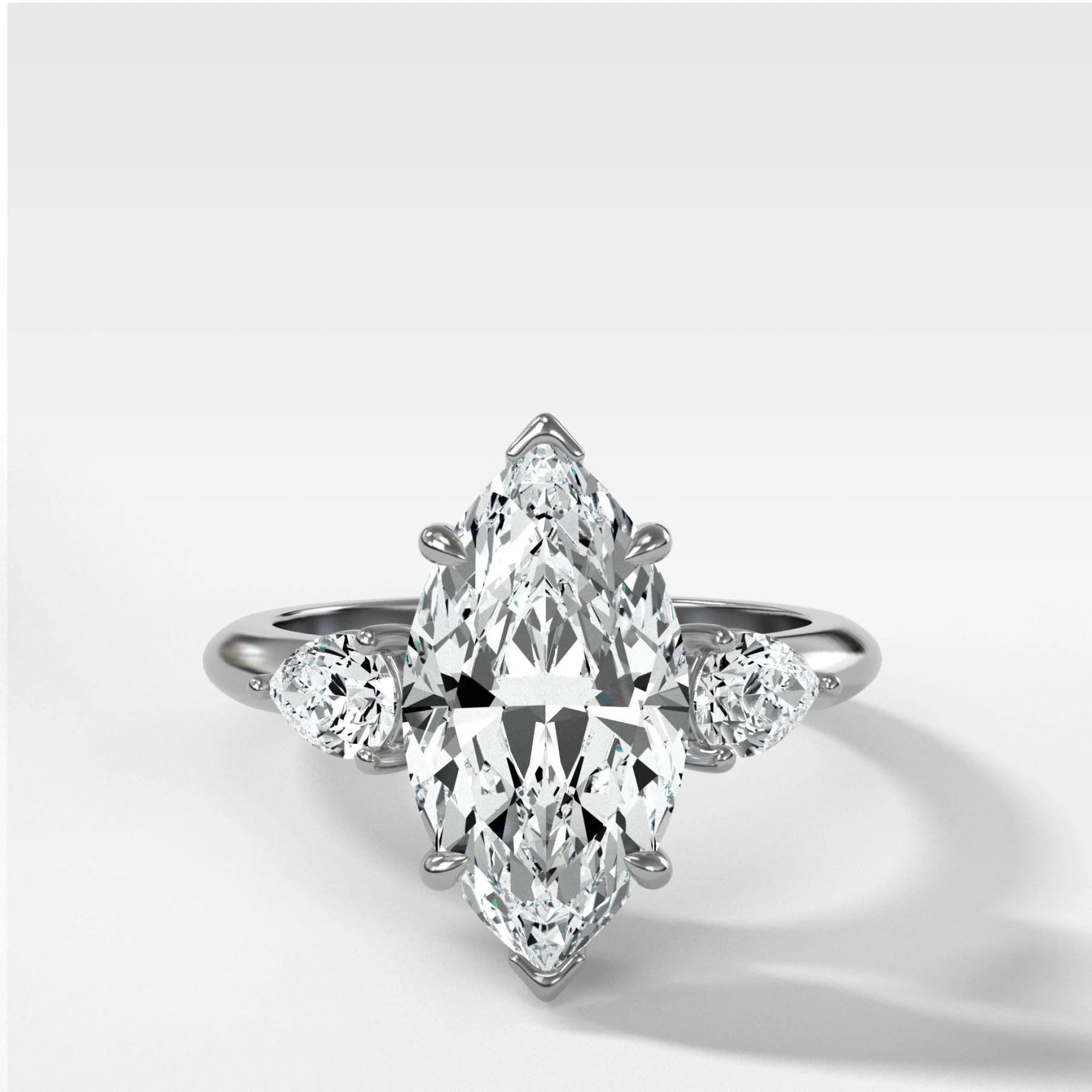 Three Stone Engagement Ring With Pear Side Stones and Marquise Cut Diamond - Image 4