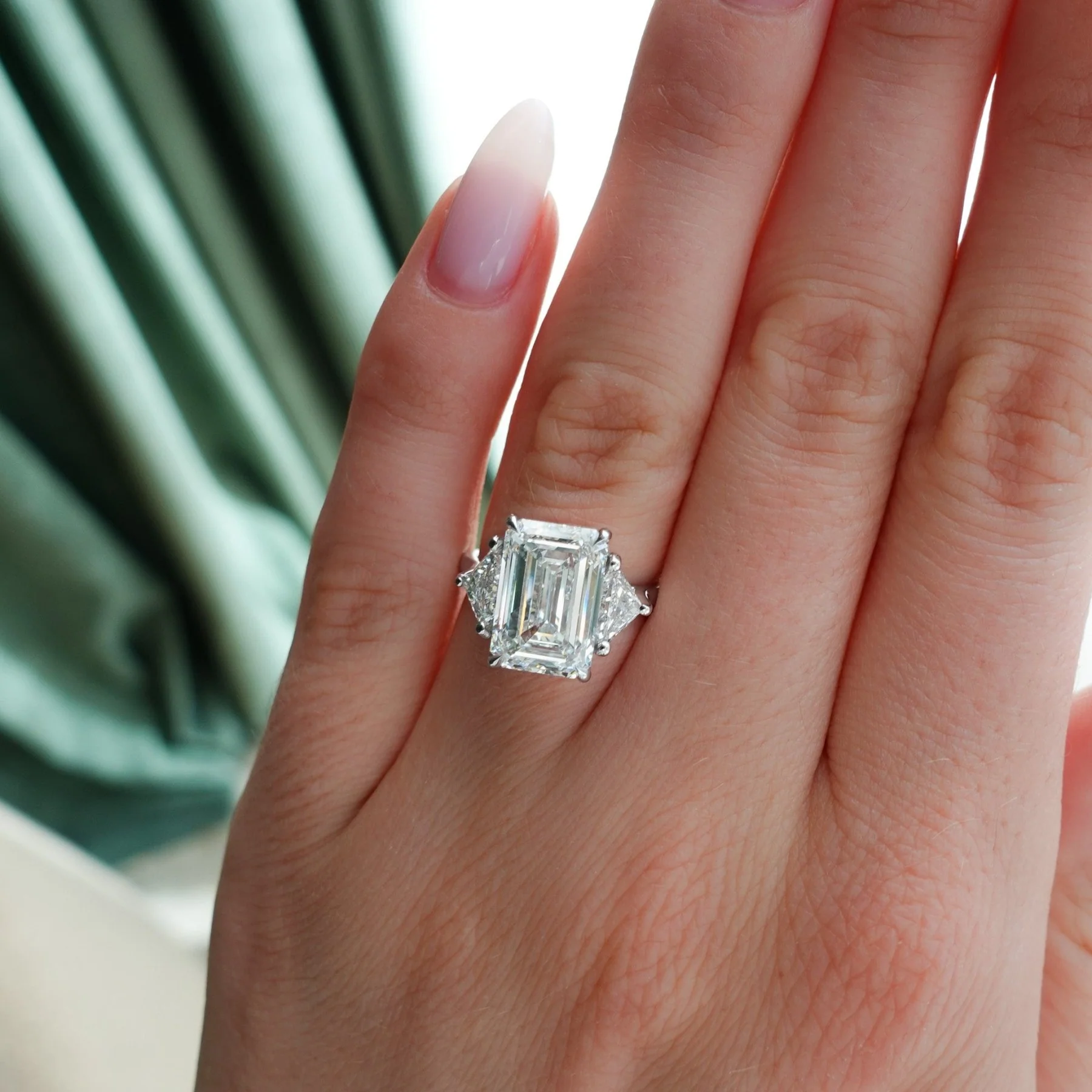 Three Stone Engagement Ring with Shield Side Stones and an Emerald Cut Diamond - Image 3
