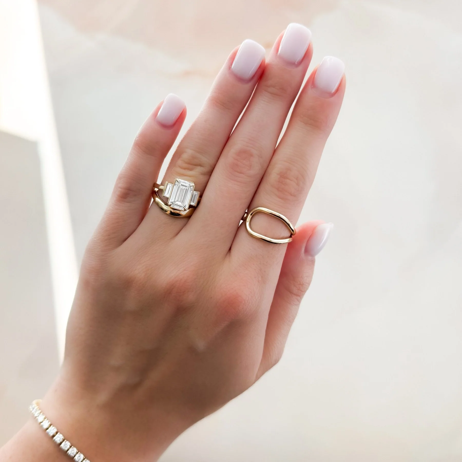 Three Stone Engagement Ring With Straight Baguette Side Stones and Emerald Cut Diamond - Image 5