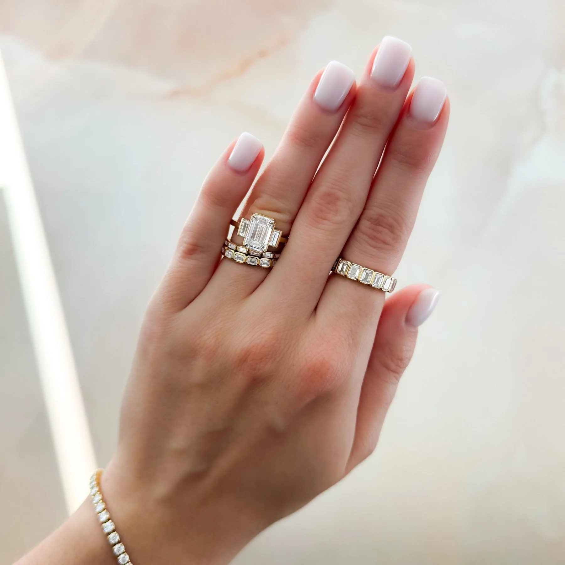 Three Stone Engagement Ring With Straight Baguette Side Stones and Emerald Cut Diamond - Image 6