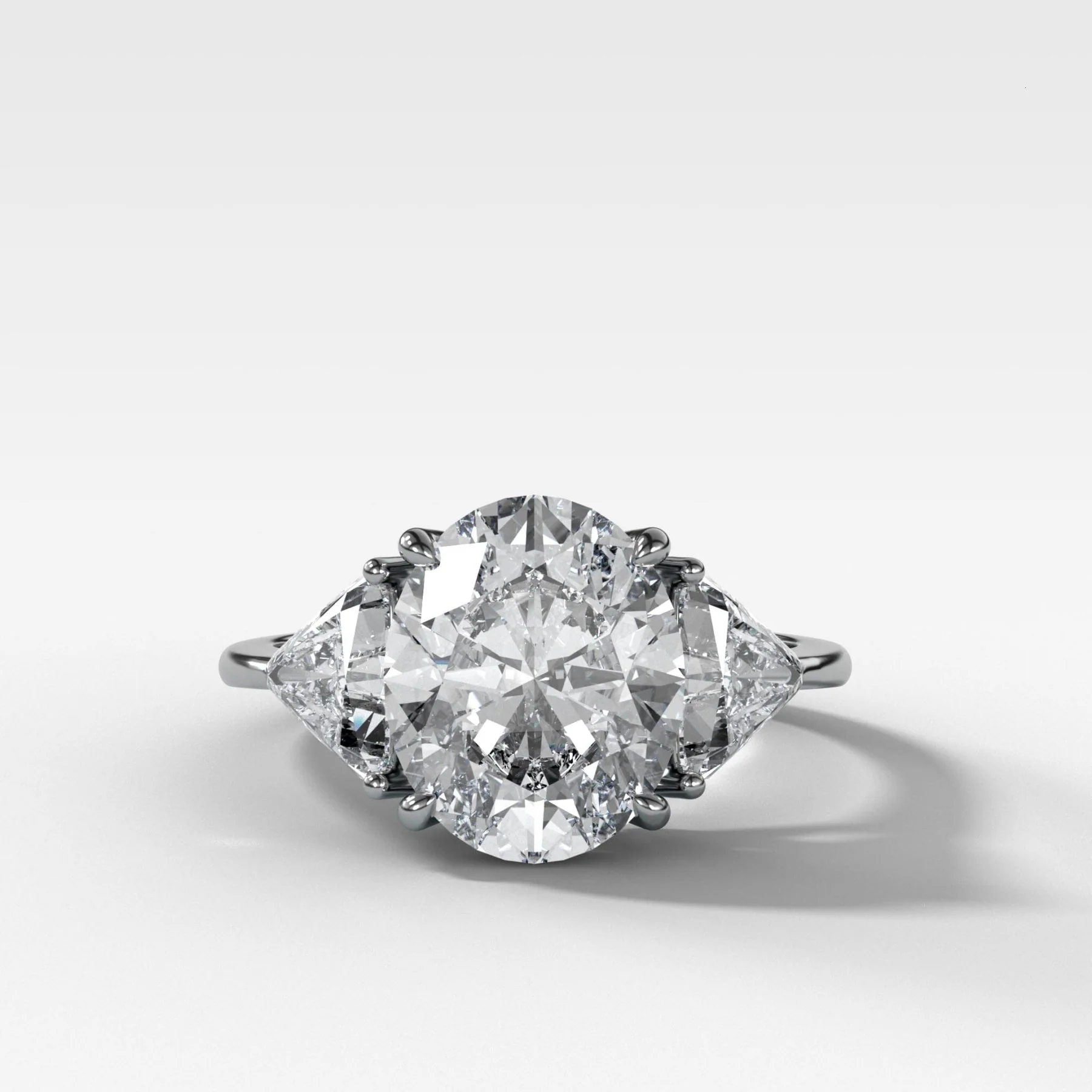Three Stone Engagement Ring with Shield Side Stones and an Oval cut Diamond - Image 2